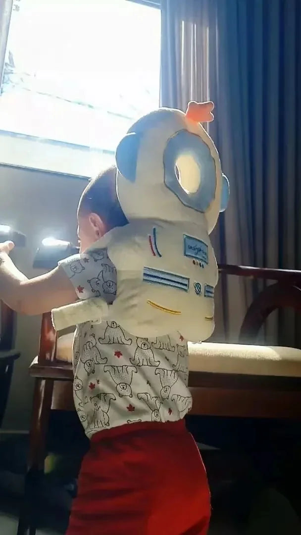 Baby wearing the Astronaut Snugjooy baby head protector, parent review
