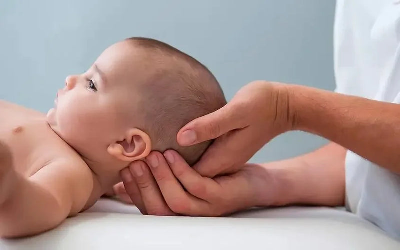 Snugjooy baby head protector cushioning a baby's backward fall onto the floor