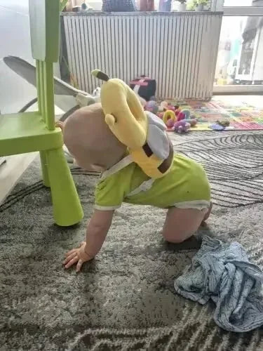 Baby wearing the Bee Snugjooy baby head protector, parent review